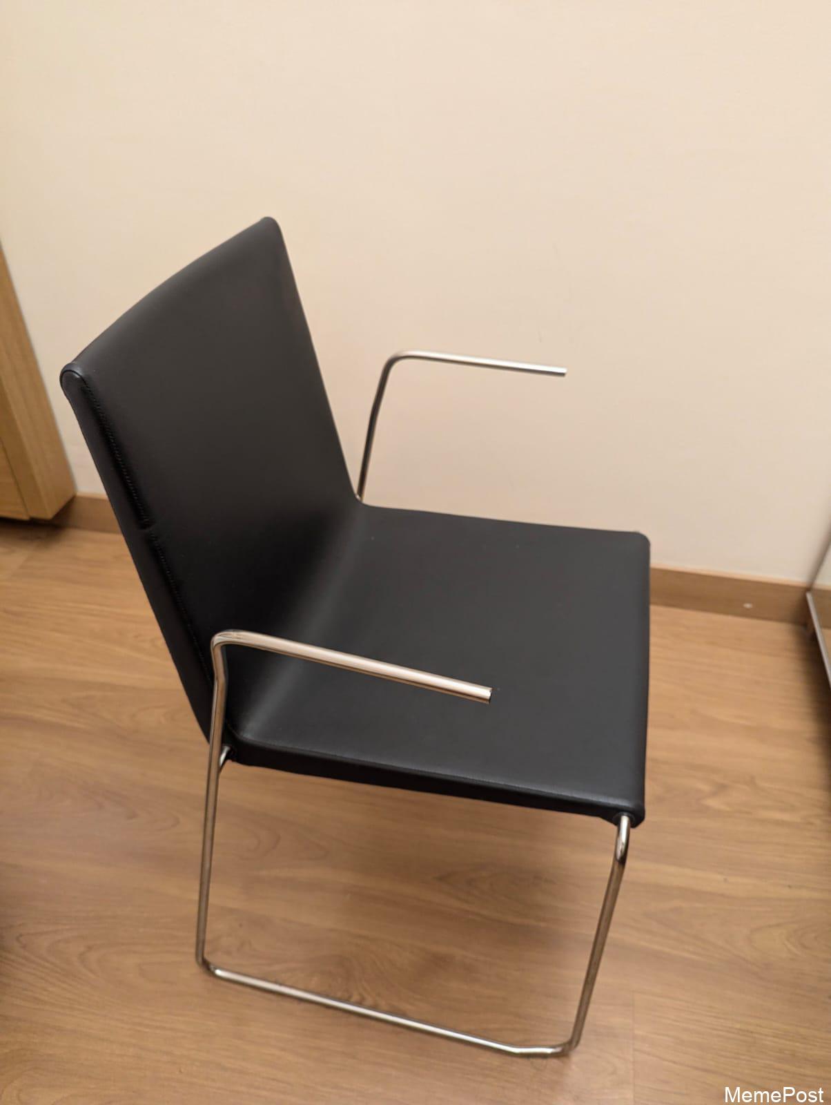 These Bare Metal Armrests on My Hotel Chair: A Design Choice or Just Poor Hotel Amenities?